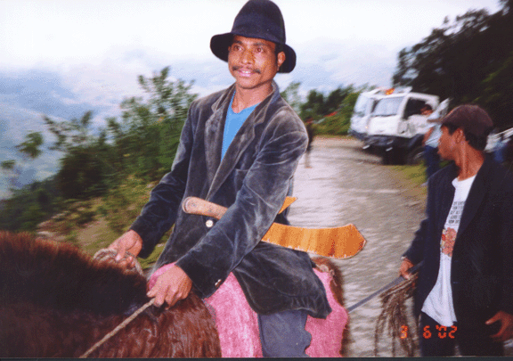4 man with machete on horse